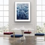 Abstract ocean wave painting ‘Deep Blue Sea’ framed in a contemporary living room, adding depth and movement to the space with its foam details.