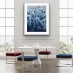 Abstract ocean wave painting ‘Deep Blue Sea’ framed in a contemporary living room, adding depth and movement to the space with its foam details.