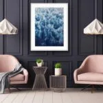 A modern living room with ‘Deep Blue Sea’ painting, showcasing the dramatic abstract ocean waves and foam for a calming atmosphere.