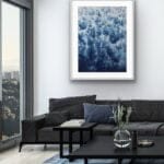Framed ‘Deep Blue Sea’ abstract ocean painting in a sleek modern living room, featuring waves and foam for a tranquil yet dynamic touch.