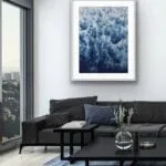 Framed ‘Deep Blue Sea’ abstract ocean painting in a sleek modern living room, featuring waves and foam for a tranquil yet dynamic touch.