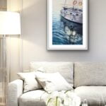 Framed ‘Beginning’ in a nautical-inspired living room, creating a peaceful atmosphere with soft blues.