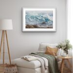 Original watercolor painting of ocean waves framed above the bed in a peaceful bedroom, bringing a calming coastal touch to the space with tranquil blue hues.