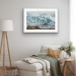 Original watercolor painting of ocean waves framed above the bed in a peaceful bedroom, bringing a calming coastal touch to the space with tranquil blue hues.
