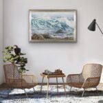 Original watercolor ocean wave painting framed in a modern living room, adding a tranquil coastal atmosphere to the space.