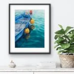 Framed ‘Blue and Yellow Boat’ in a coastal living room, enhancing the room with a peaceful nautical atmosphere.