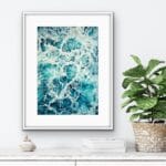 Framed seascape 'My Heart Belongs to the Sea' above a minimalist shelf, bringing tranquility to the space.
