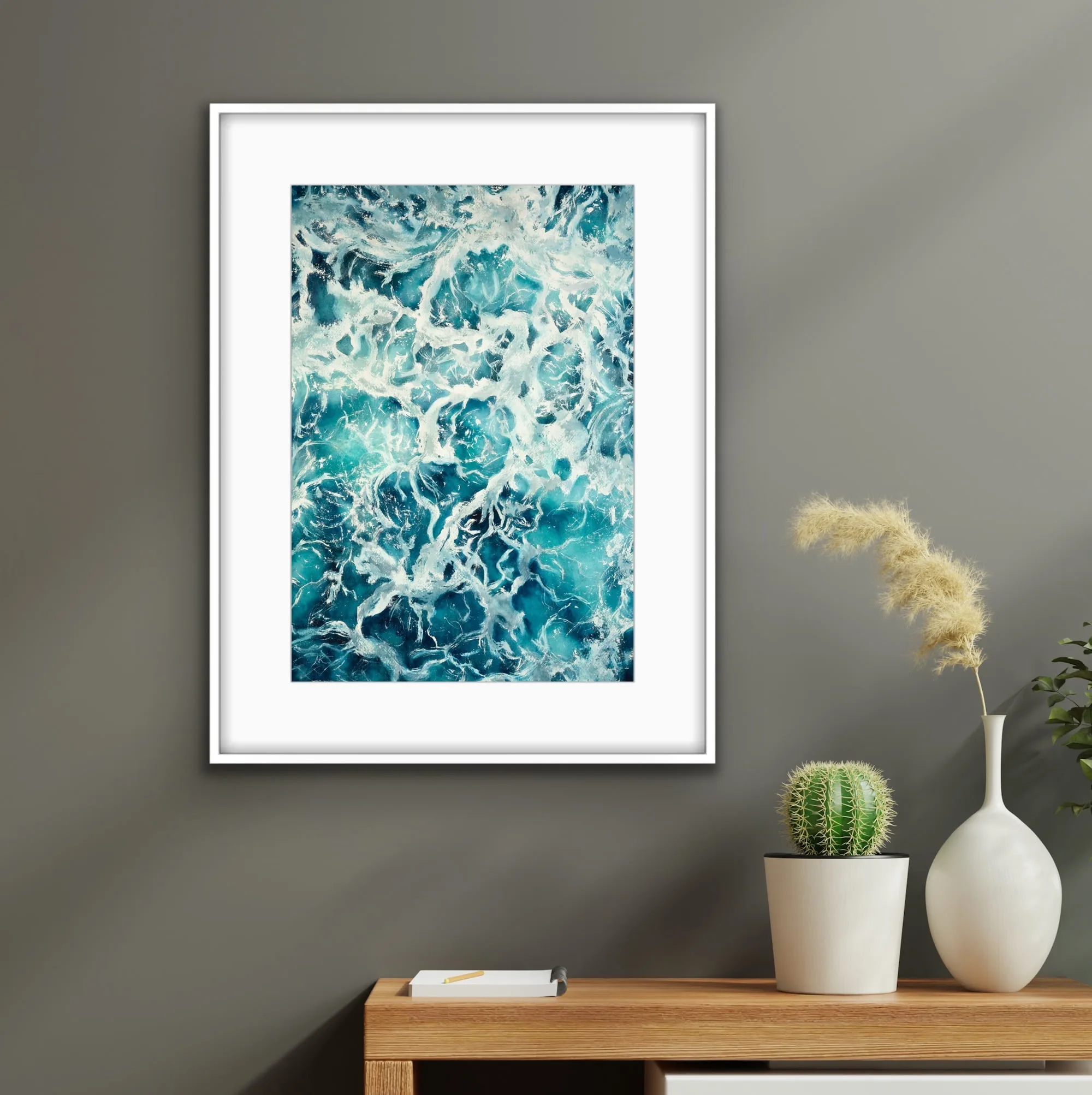 Framed 'My Heart Belongs to the Sea' displayed above a minimalist wooden shelf, paired with nautical decor for a calming coastal touch.