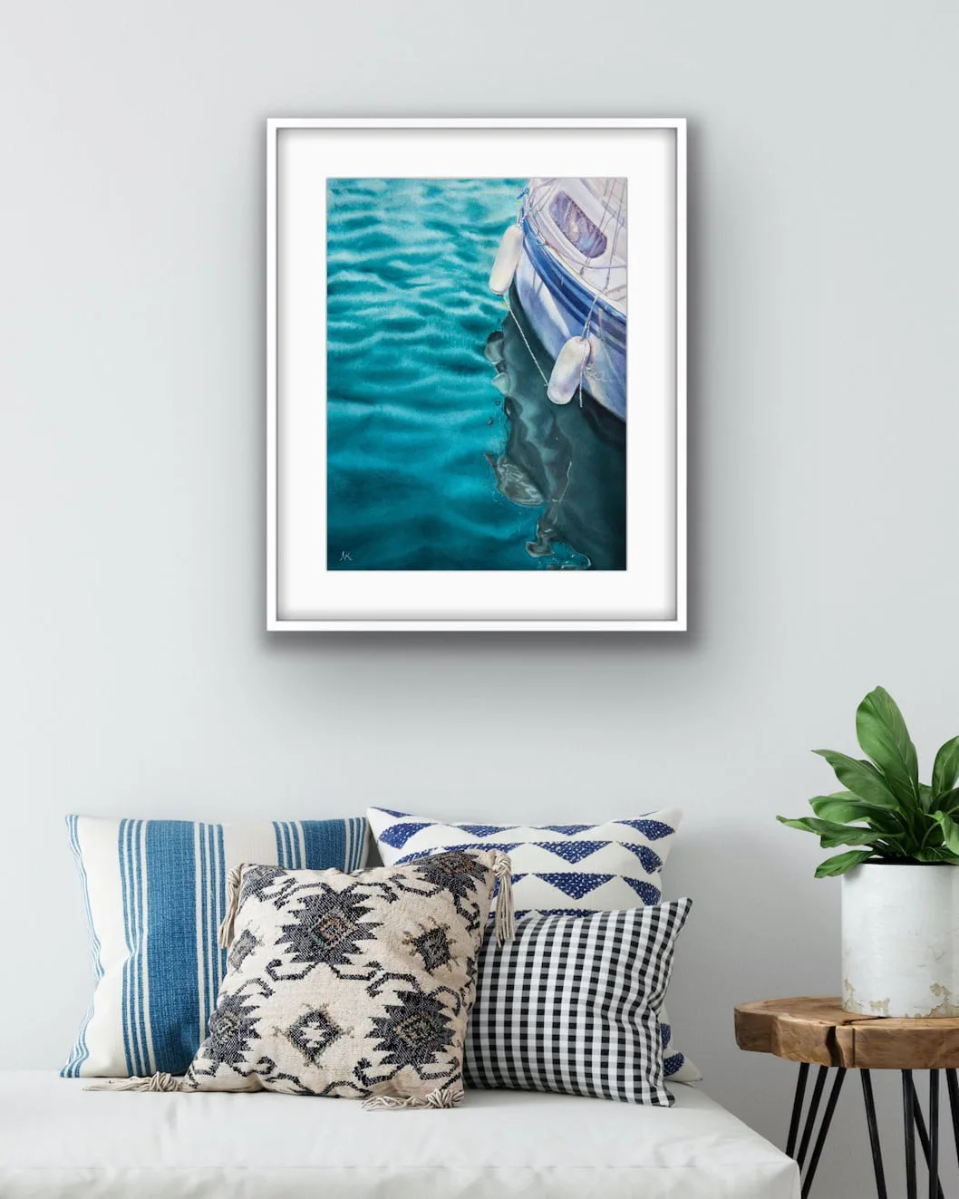 "Summer Memories" watercolor painting of a yacht on calm green water framed in a coastal home, infusing the space with tranquil ocean views.