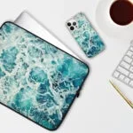 ‘My Heart Belongs to the Sea’ artwork on a laptop case and iPhone case, featuring soothing watercolor ocean waves in soft blue tones, perfect for coastal style enthusiasts and marine art lovers.