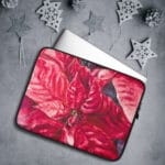 Vibrant red poinsettia Christmas flower laptop case with watercolor art, ideal for seasonal accessories.