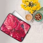 Watercolor red poinsettia floral design on laptop case, adding a festive touch to your workspace.