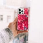 Vibrant red poinsettia watercolor art on iPhone case, ideal for Christmas and seasonal decor.