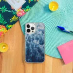 Protect your iPhone with an artistic case featuring ‘Deep Blue Sea’ abstract ocean waves and foamy texture.