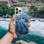 Ocean wave-inspired iPhone case featuring ‘Deep Blue Sea,’ with abstract foamy waves and dynamic blue water design.