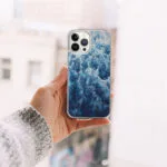 Abstract ocean design on an iPhone case, featuring the foam and waves from ‘Deep Blue Sea’ painting in rich blue hues.