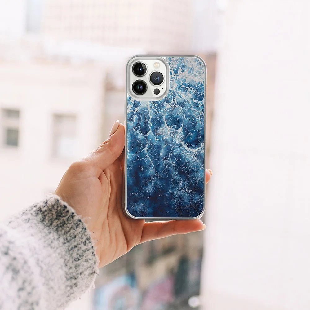 Abstract ocean design on an iPhone case, featuring the foam and waves from ‘Deep Blue Sea’ painting in rich blue hues.