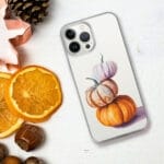 Vibrant autumn-inspired pumpkin watercolor art on a clear iPhone case, a perfect blend of seasonal charm and functionality.