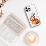 Pumpkin watercolor painting printed on a clear iPhone case, adding a cozy fall vibe to your everyday tech.