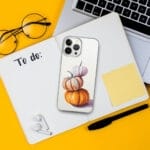 Watercolor art of stacked orange pumpkins featured on a clear iPhone case, perfect for autumn decor and fall-themed accessories.