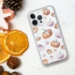 Playful clear iPhone case with vibrant orange pumpkins in a seamless watercolor design for festive fall vibes.