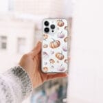 Seamless orange watercolor pumpkin pattern clear iPhone case, a stylish accessory for the autumn season.