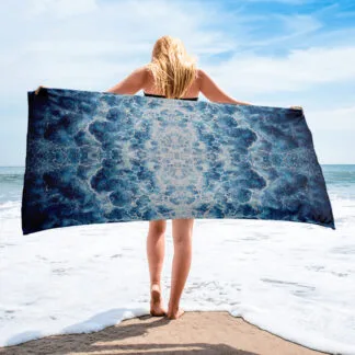 Beach Towel with a print of the abstract navy blue ocean water