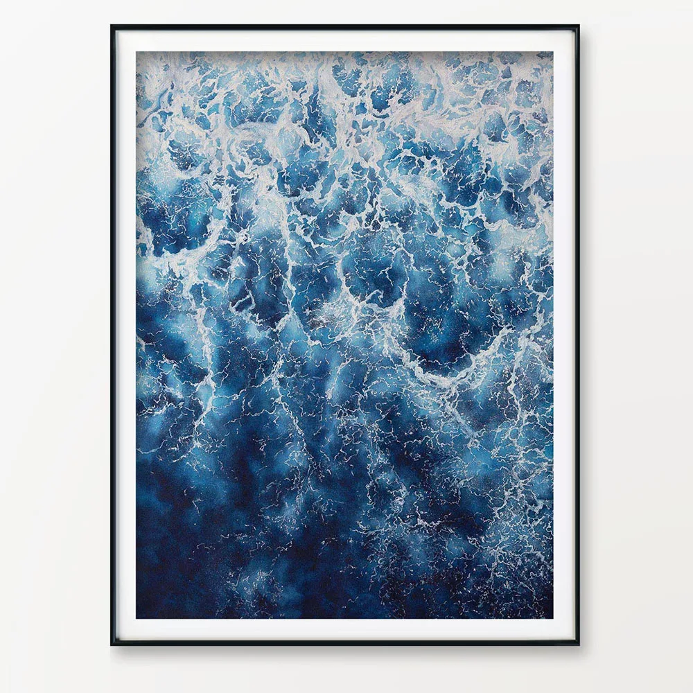 ‘Deep Blue Sea’ abstract ocean painting framed on the wall, highlighting dynamic waves and foam, adding a modern coastal touch to the room.