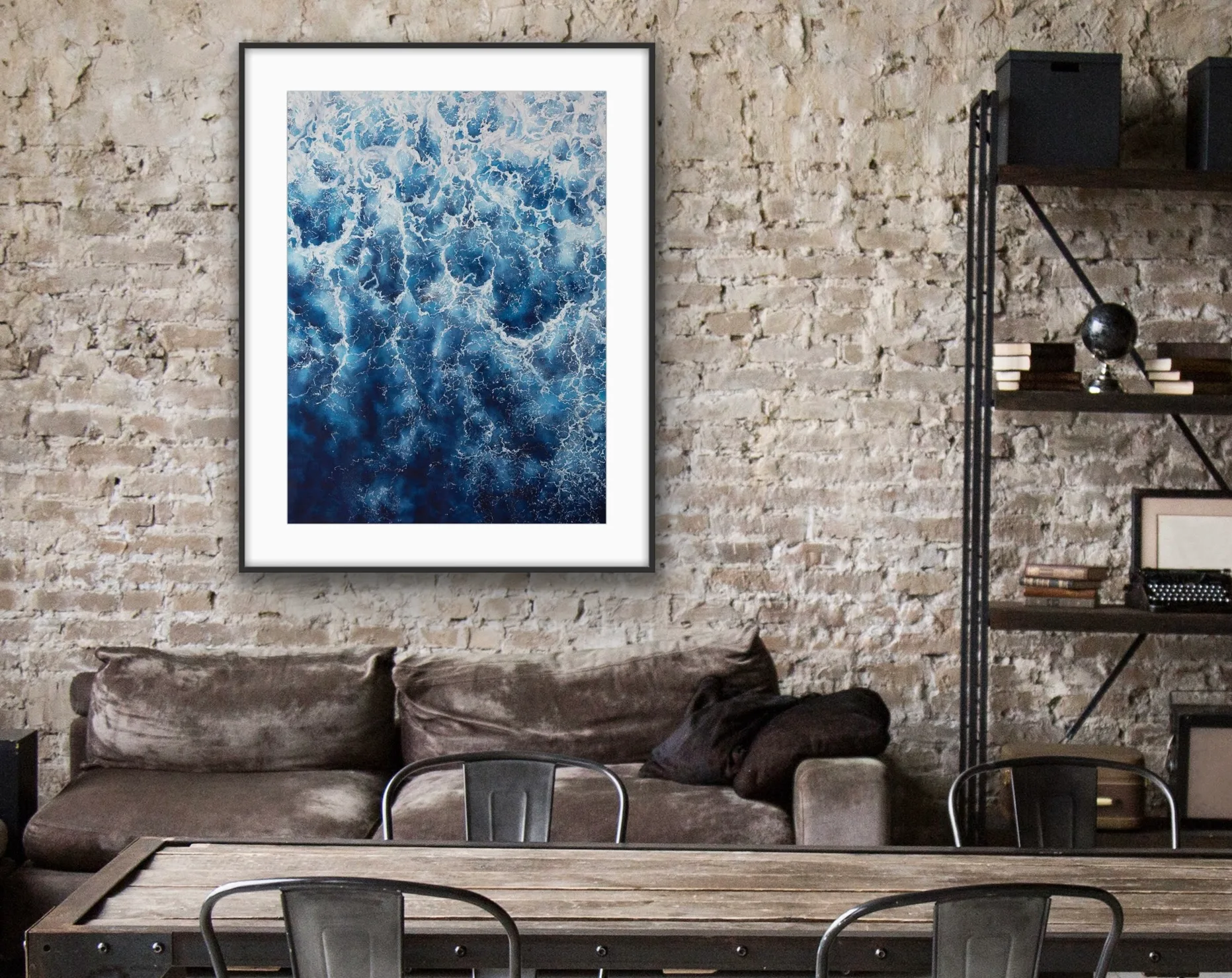 ‘Deep Blue Sea’ painting displayed in a loft designed living room, with abstract waves and foam adding depth to decor.