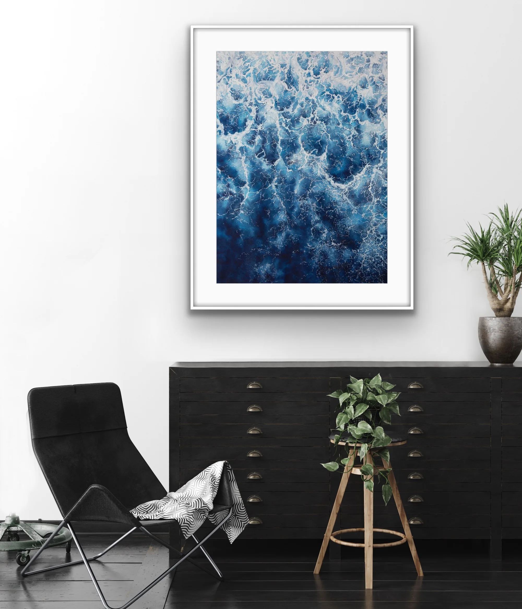 Framed ‘Deep Blue Sea’ above a shelf in a living room, creating an ocean-inspired ambiance with foam details.