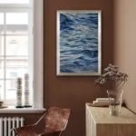 “Evening Mood” watercolor seascape framed in a contemporary living room, enhancing the serene atmosphere of the space