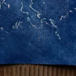 Signature of artist Kateryna Nazarenko on 'Ocean Blues' watercolor seascape painting.
