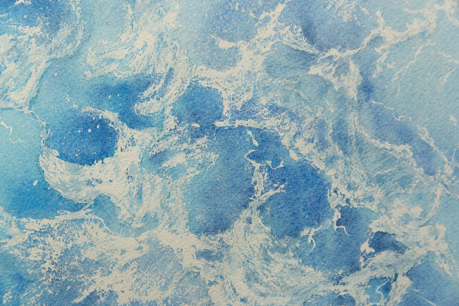 Detailed view of foam on ocean waves in 'Ocean Blues' watercolor painting