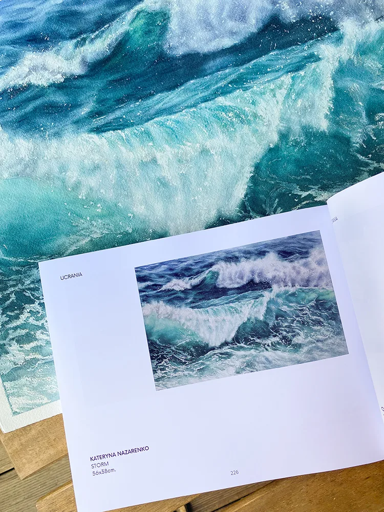 Exhibited in Spain, ‘Storm’ is a standout piece in Kateryna Nazarenko’s collection. The accompanying catalogue highlights this vibrant watercolor painting, where bold brushstrokes and deep blue tones capture the essence of a turbulent ocean.