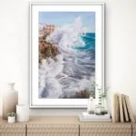 ‘Breaking Wave’ painting in a coastal home, displayed above a wooden commode for marine-themed decor. wave