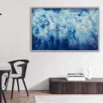 Framed 'Ocean Blues' seascape art in a contemporary dining room with natural wood accents.