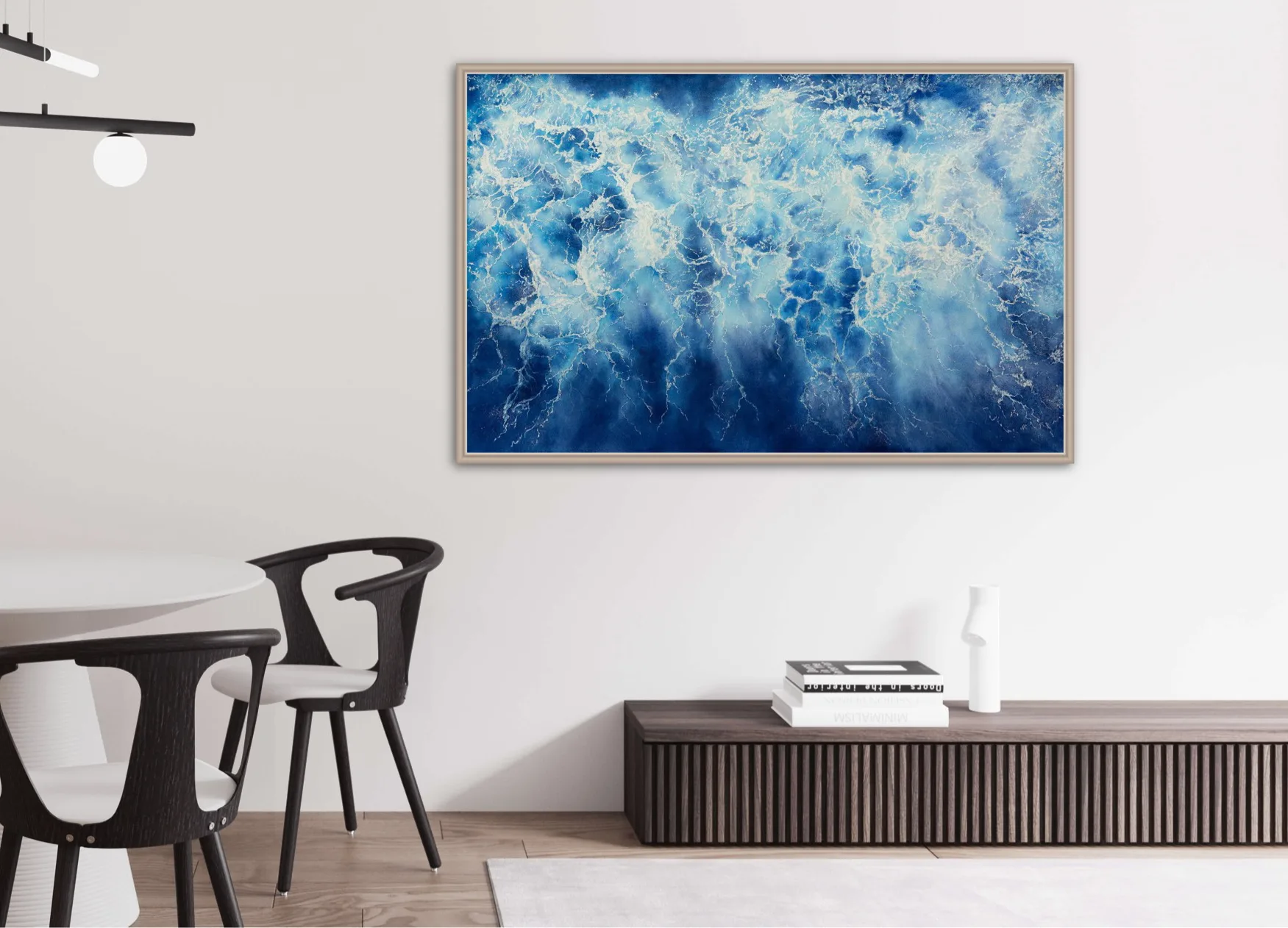 Framed 'Ocean Blues' seascape art in a contemporary dining room with natural wood accents.