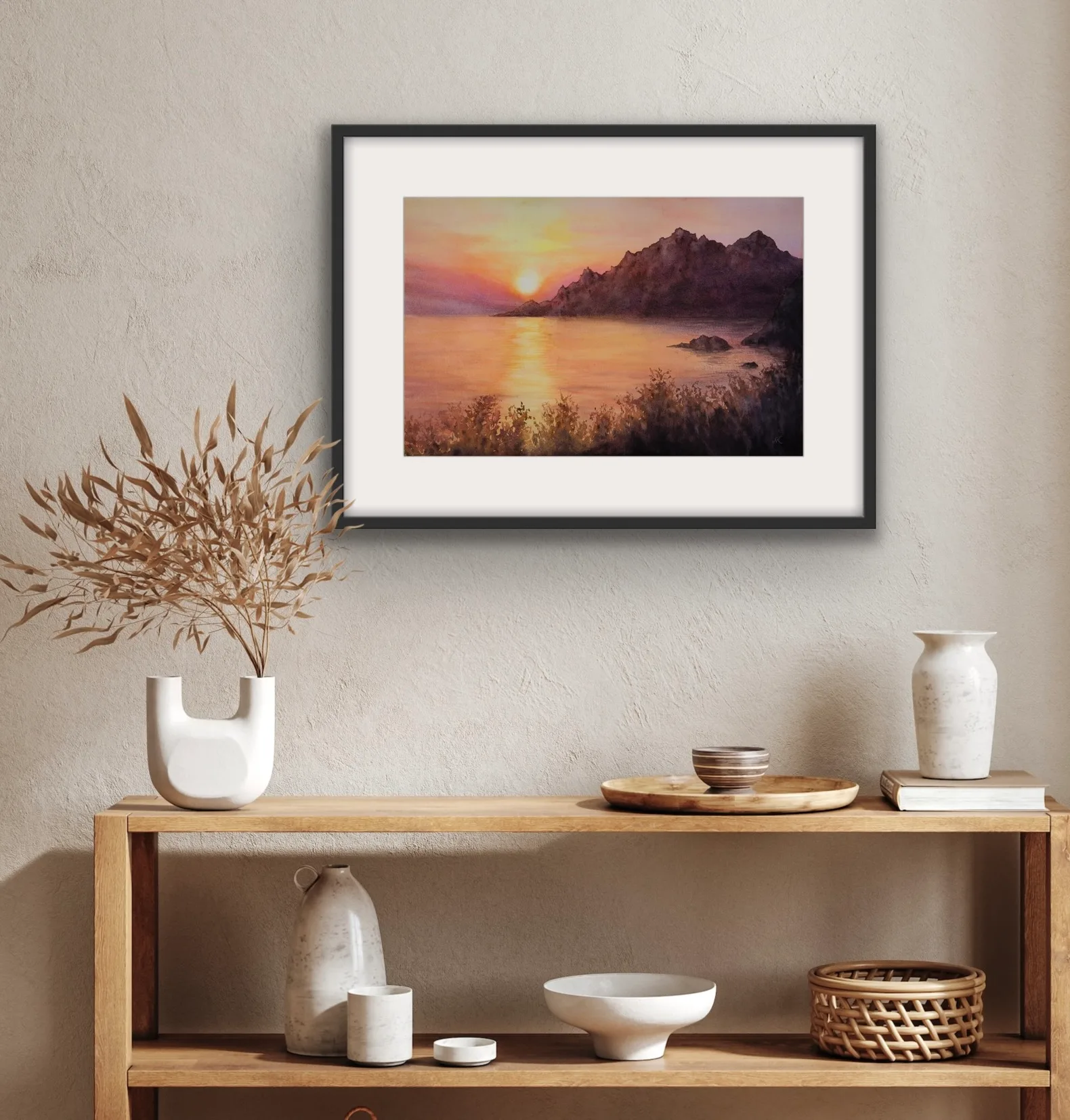 Warm watercolor seascape displayed above a console table, perfect for a transitional home.