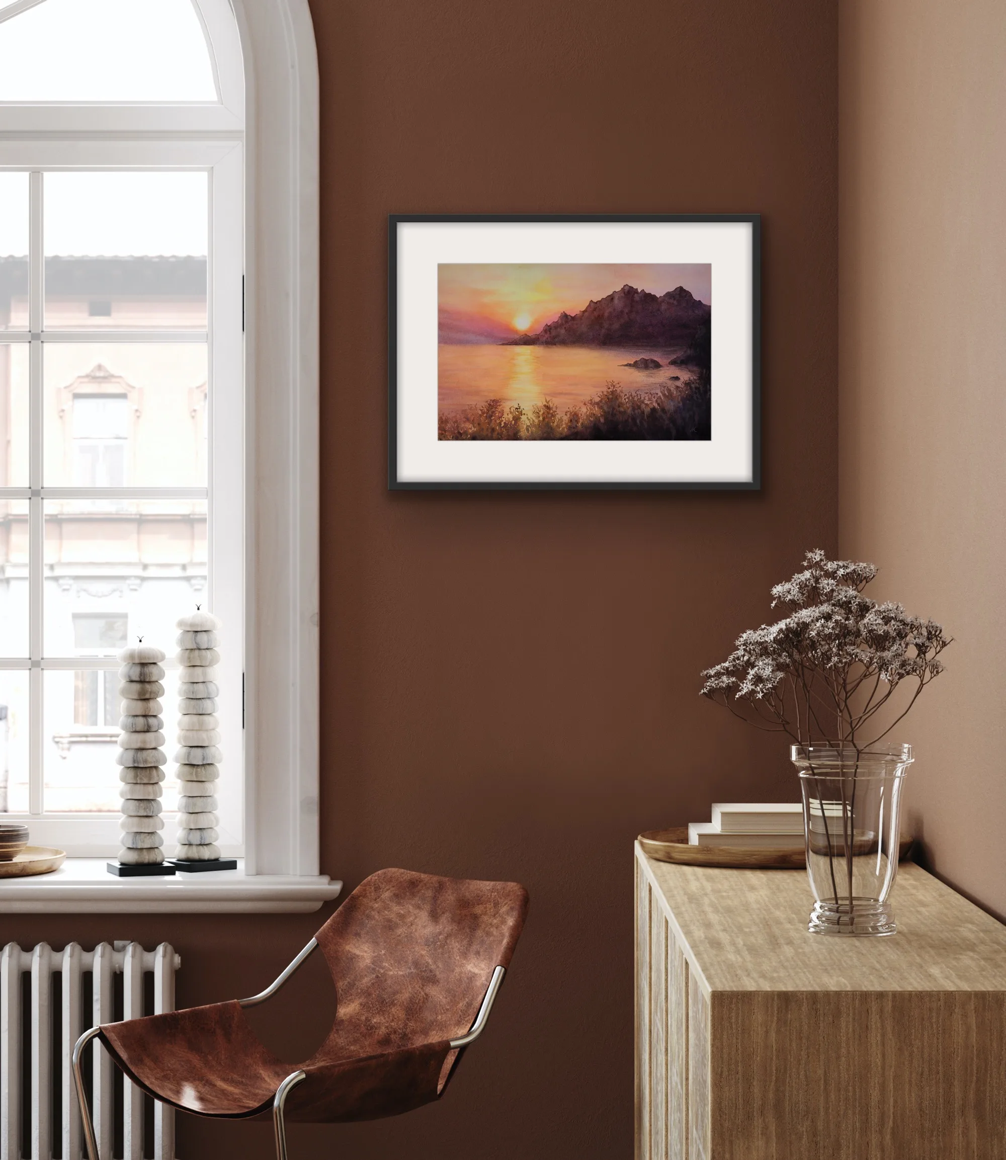 Framed 'Sunset on the Corsica Coast' seascape displayed in a modern living room, enhancing coastal decor.