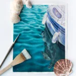 "Summer Memories" watercolor painting of a yacht on calm green waters, resting on artist's table, bringing a tranquil coastal vibe with its serene seascape and soft hues of the ocean.