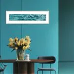 ‘Sparkles on Turquoise Water’ framed in a modern dining room, adding a serene ocean-inspired atmosphere to the space with its calming turquoise tones.