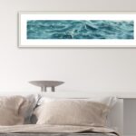 'Sparkles on Turquoise Water' framed in a serene bedroom, enhancing the peaceful atmosphere with its ocean-inspired colors."
