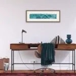 'Sparkles on Turquoise Water' framed above a desk in a home office, adding calming energy to the workspace.