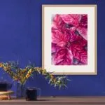 Vibrant magenta Poinsettia watercolor painting above a shelf in a cozy living room, adding festive charm and holiday spirit to the space.