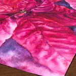 Focused closeup of the blooming Poinsettia's bright magenta hues, showing the dynamic movement in the watercolor technique.