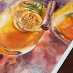 Detailed view of the luminous glass in a Christmas punch watercolor painting, showcasing warm orange hues.