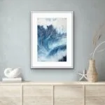 Framed ‘Night Wave’ in a coastal interior, enhancing the room’s seaside ambiance with its bold navy blue waves and dynamic ocean energy.