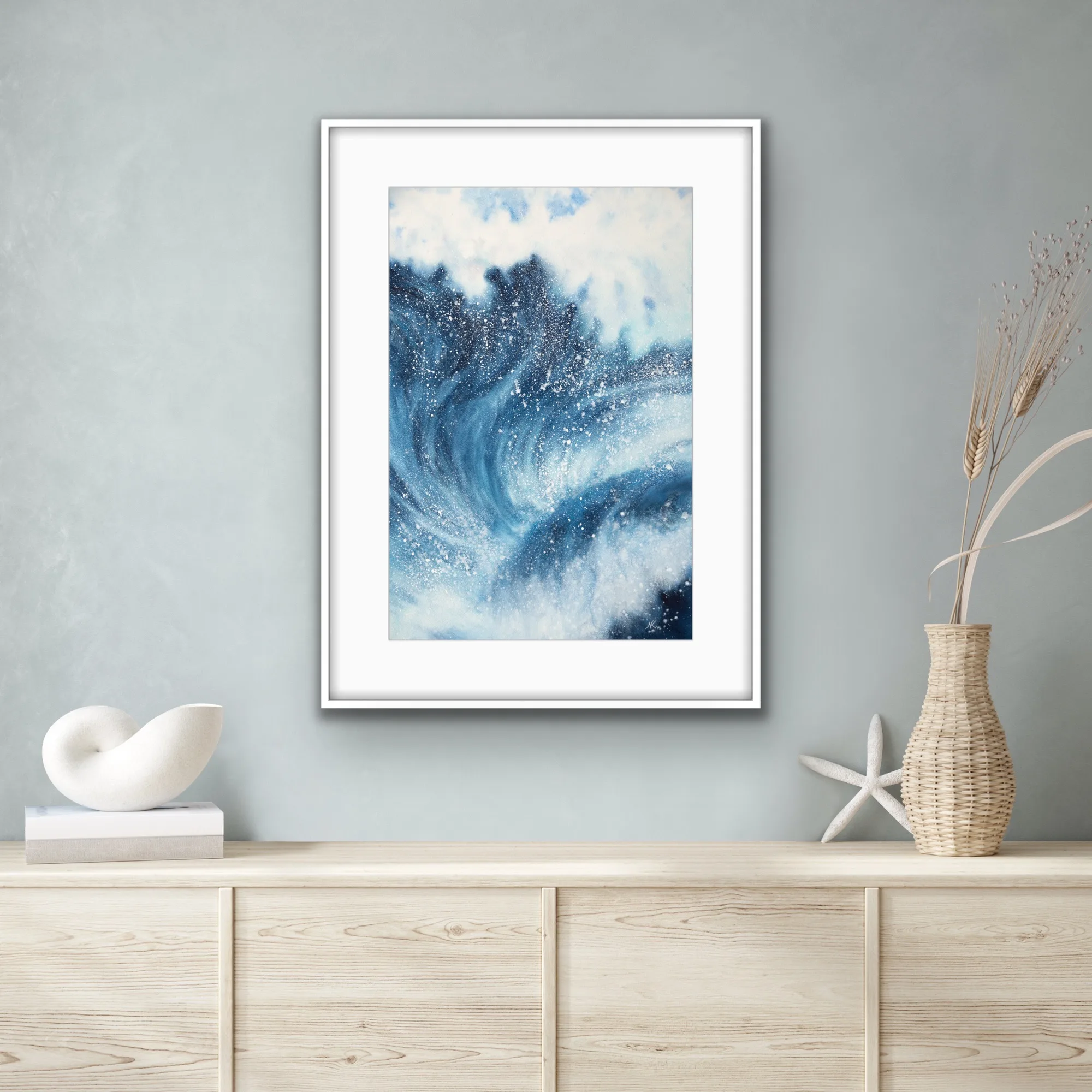 Framed ‘Night Wave’ in a coastal interior, enhancing the room’s seaside ambiance with its bold navy blue waves and dynamic ocean energy.