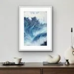 Framed ‘Night Wave’ in a modern living room, creating a striking focal point with its dynamic ocean waves and deep navy blue tones.