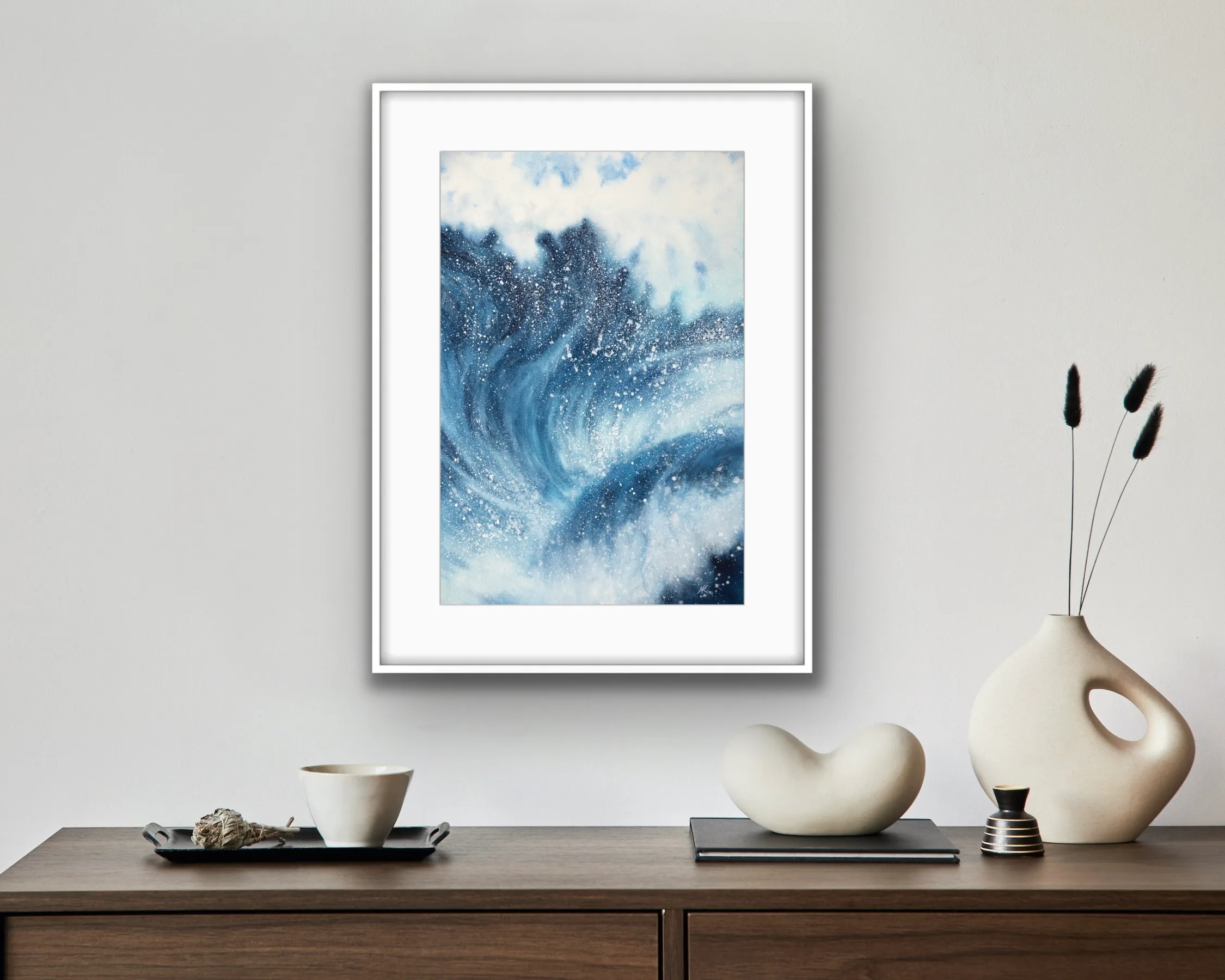 Framed ‘Night Wave’ in a modern living room, creating a striking focal point with its dynamic ocean waves and deep navy blue tones.